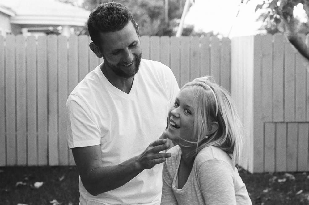 Dad (Jeff), and daughter (Kate) goof around while Alex takes a photo. ©William Bay Photographic Arts.