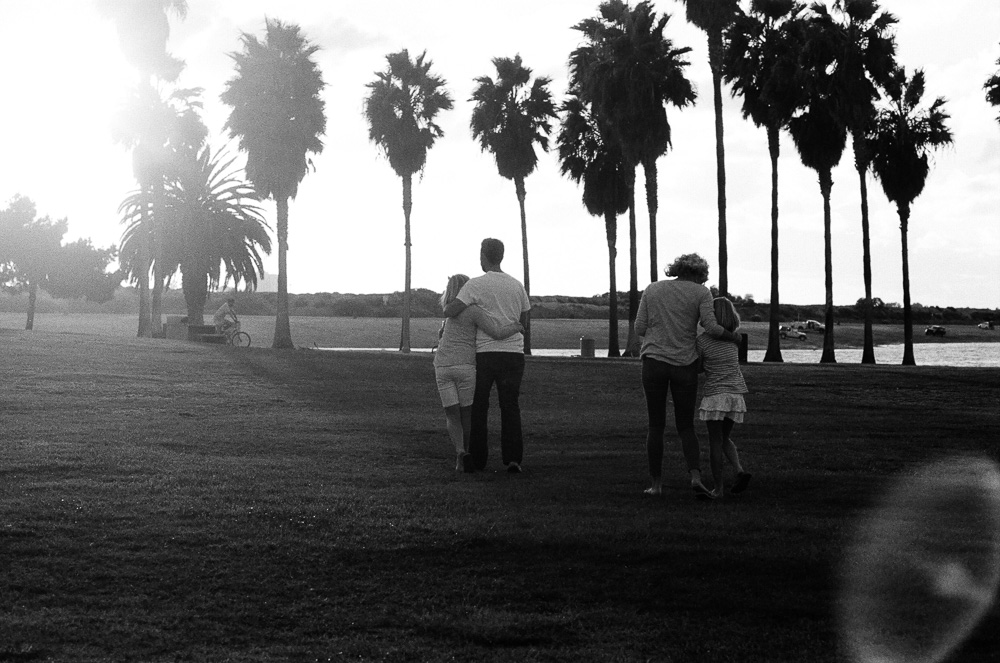 Family walking through Tecolote Park. ©William Bay Photographic Arts.