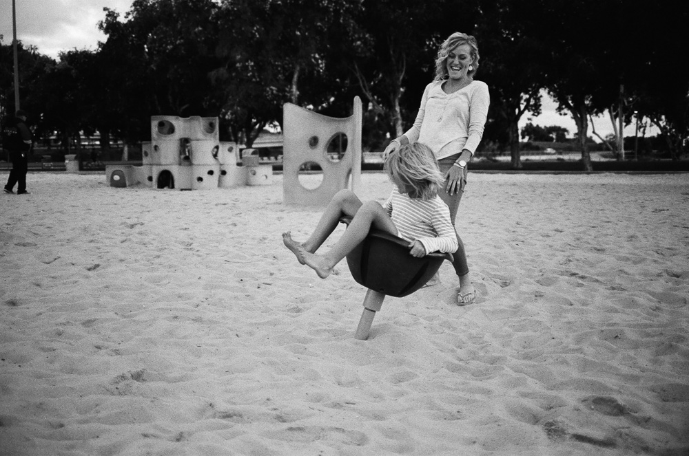 Daughter spinning fast in a spinning park ride. ©William Bay Photographic Arts.