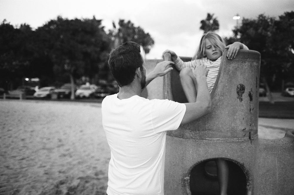 Dad (Jeff), collecting his daughter (Alex) off the play equipment. ©William Bay Photographic Arts.