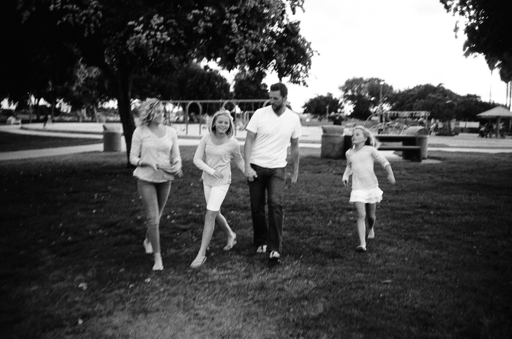 Whole family at the end of a day. Walking back to their car. ©William Bay Photographic Arts.