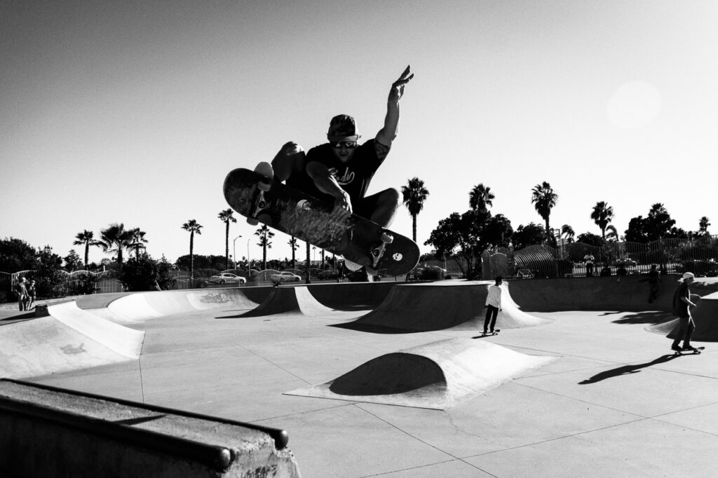 Skater frontside air over hip at the OB Robb Field skatepark.