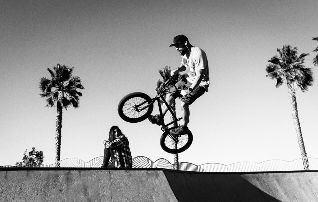 BMX rider - boosting air over girl at the OB Robb Field skatepark.