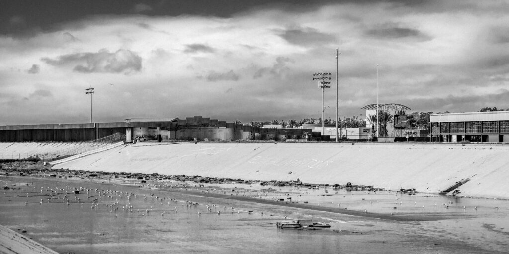 The Tijuana River after a small rain. Looking towards the US border fence.