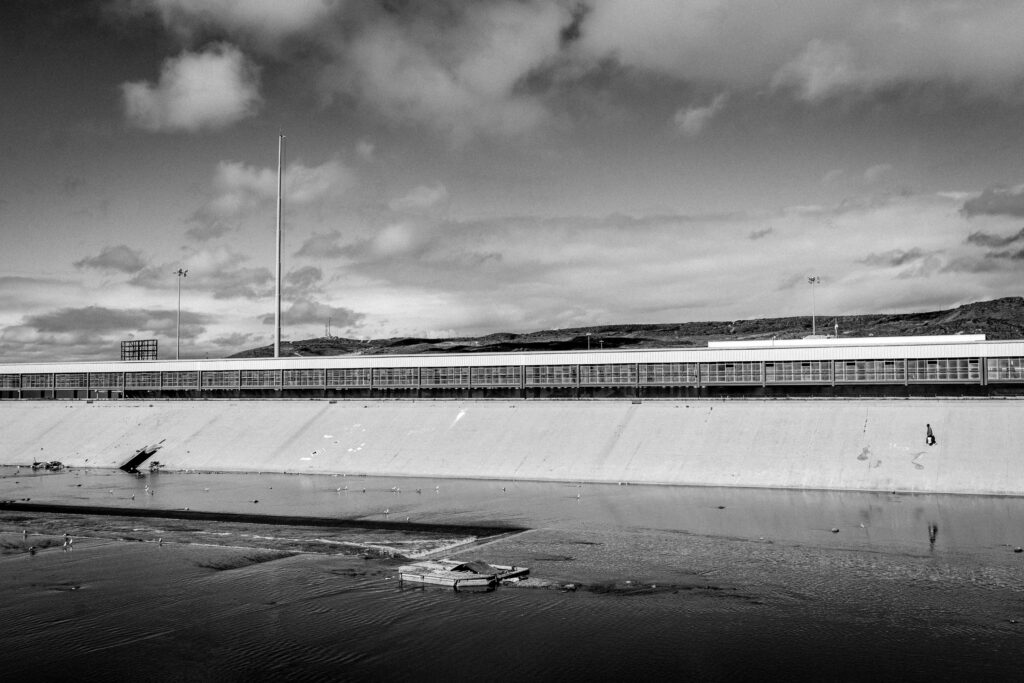 The Tijuana River after a small rain. Looking towards the US border fence.