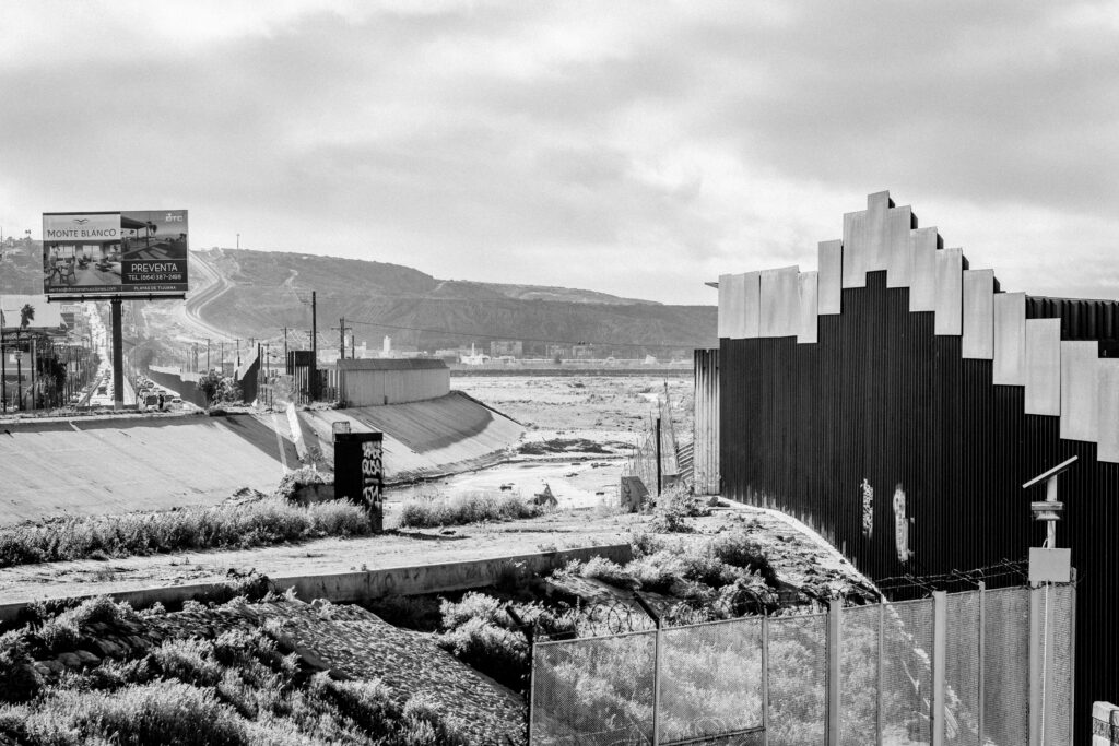Looking along the border fence from Pedwest towards Playas with the Tijuana River Estuary on the US side to the right.